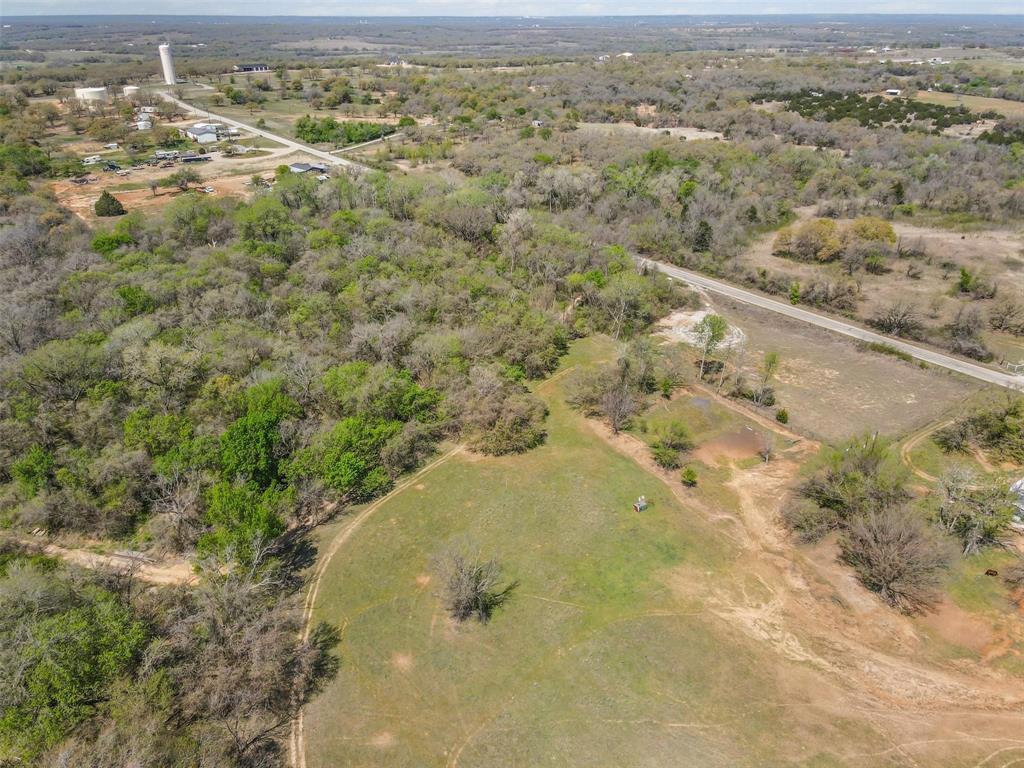 0 County Road 3855 Poolville, TX 76487 - Photo 6 of 21 an aerial view of residential houses with outdoor space