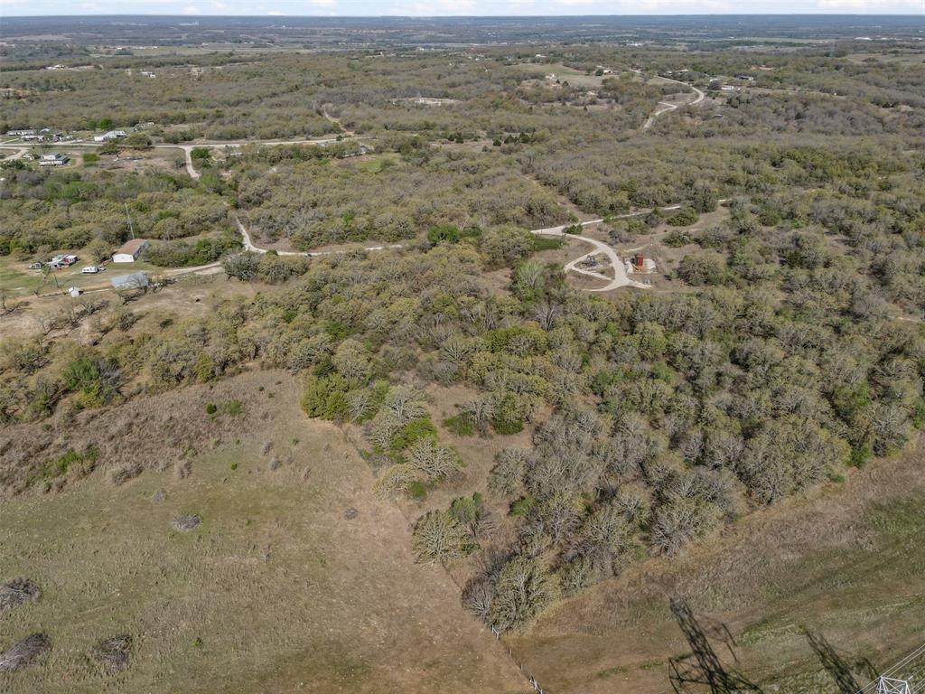0 County Road 3855 Poolville, TX 76487 - Photo 8 of 21 an aerial view of residential houses with outdoor space