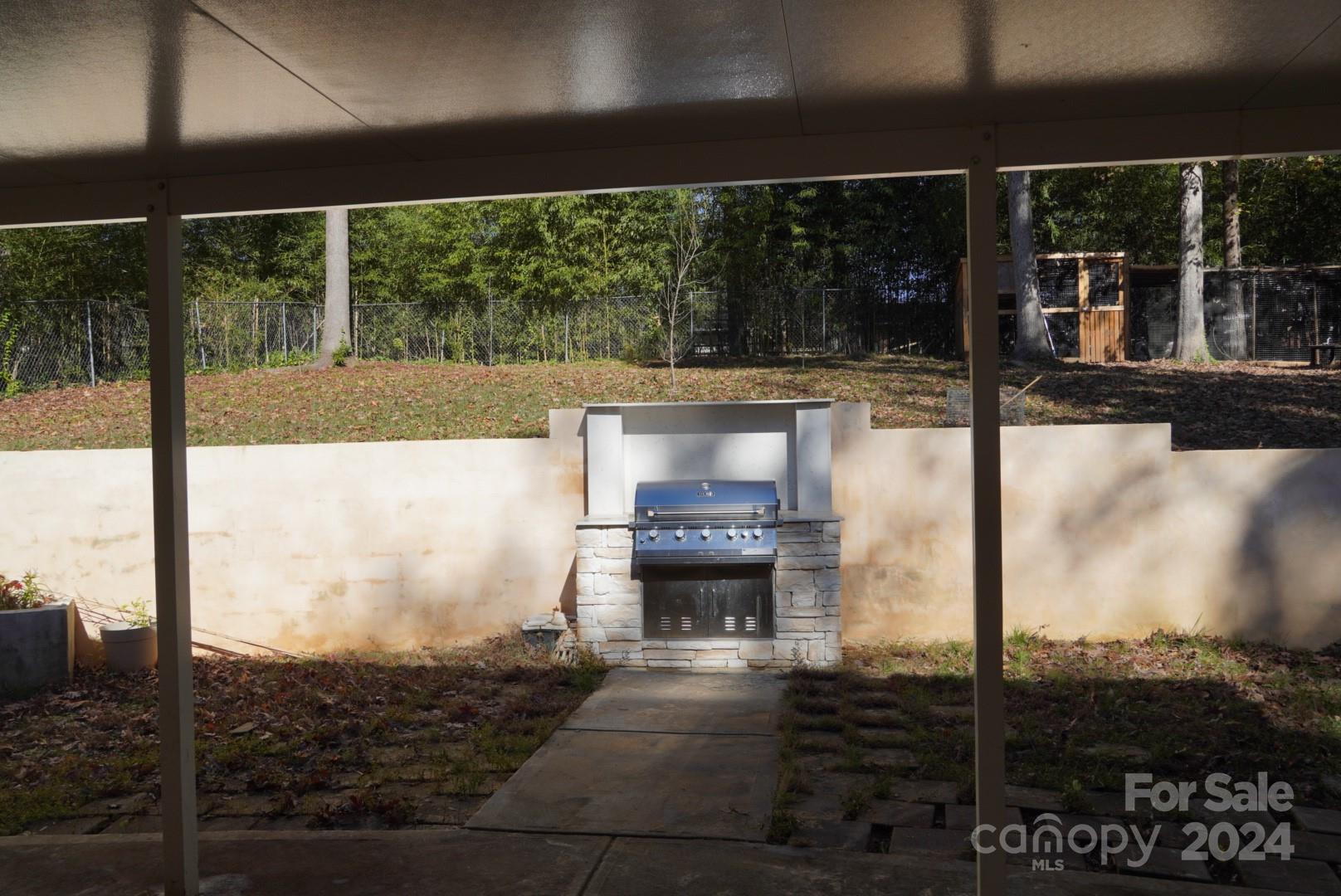 8357 Barncliff Road Charlotte, NC 28227 - Photo 13 of 15 a living room with a floor to ceiling window and a ceiling fan