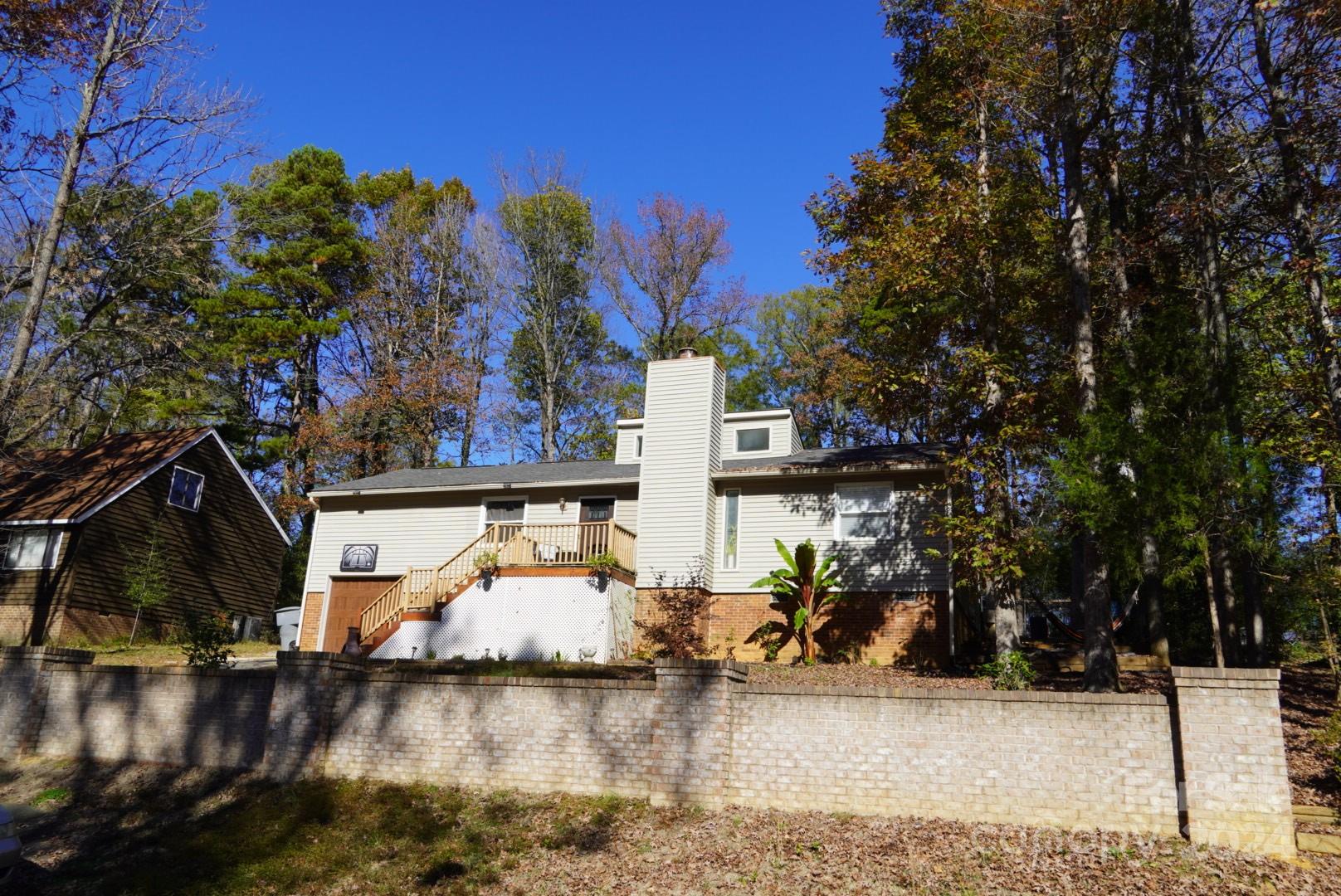 8357 Barncliff Road Charlotte, NC 28227 - Photo 15 of 15 a view of a house with a yard