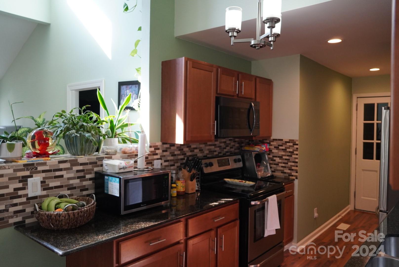8357 Barncliff Road Charlotte, NC 28227 - Photo 3 of 15 a kitchen with lots of counter top space
