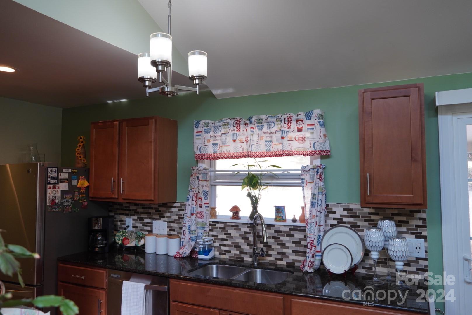8357 Barncliff Road Charlotte, NC 28227 - Photo 4 of 15 a bathroom with a sink and a mirror