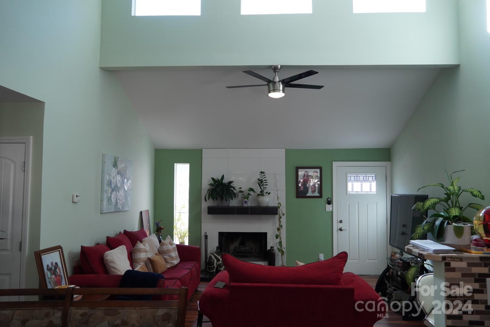 8357 Barncliff Road Charlotte, NC 28227 - Photo 5 of 15 a living room with furniture and a fireplace