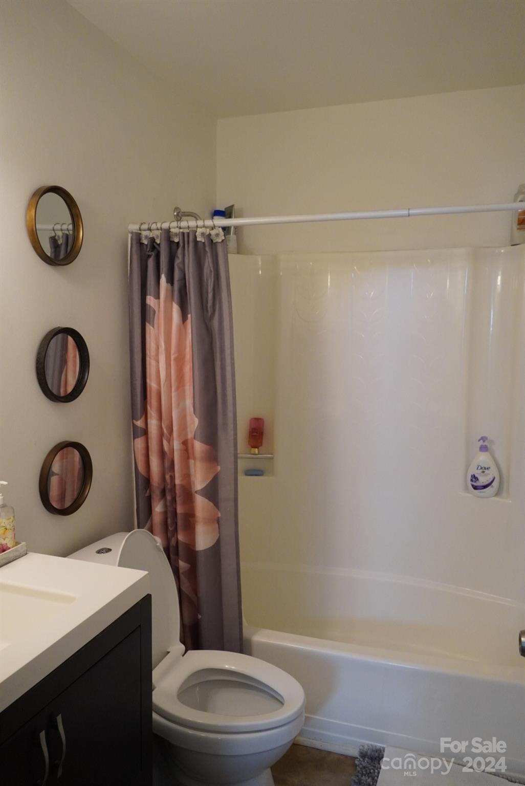 8357 Barncliff Road Charlotte, NC 28227 - Photo 6 of 15 a bathroom with a granite countertop bathtub sink vanity mirror and toilet