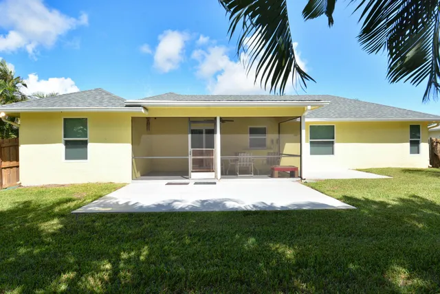 a house that has a big yard in front of it