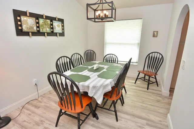 a view of a dining room with furniture window and wooden floor