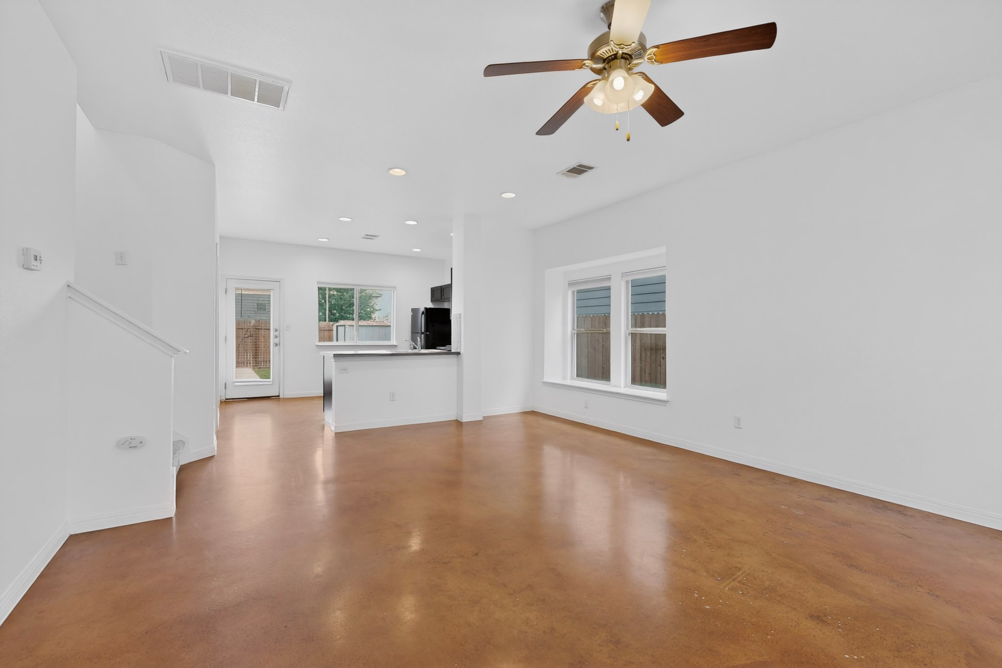 4619 Inicio Lane Austin, TX 78725 - Photo 7 of 32 a view of an empty room with window and wooden floor