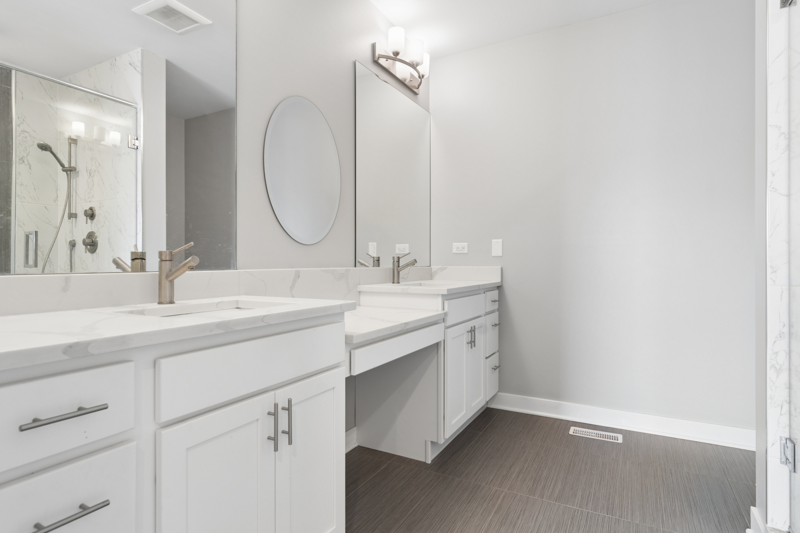 4845 North Keystone Avenue, Unit 2N Chicago, IL 60630 - Photo 12 of 21 a bathroom with a double vanity sink and a mirror