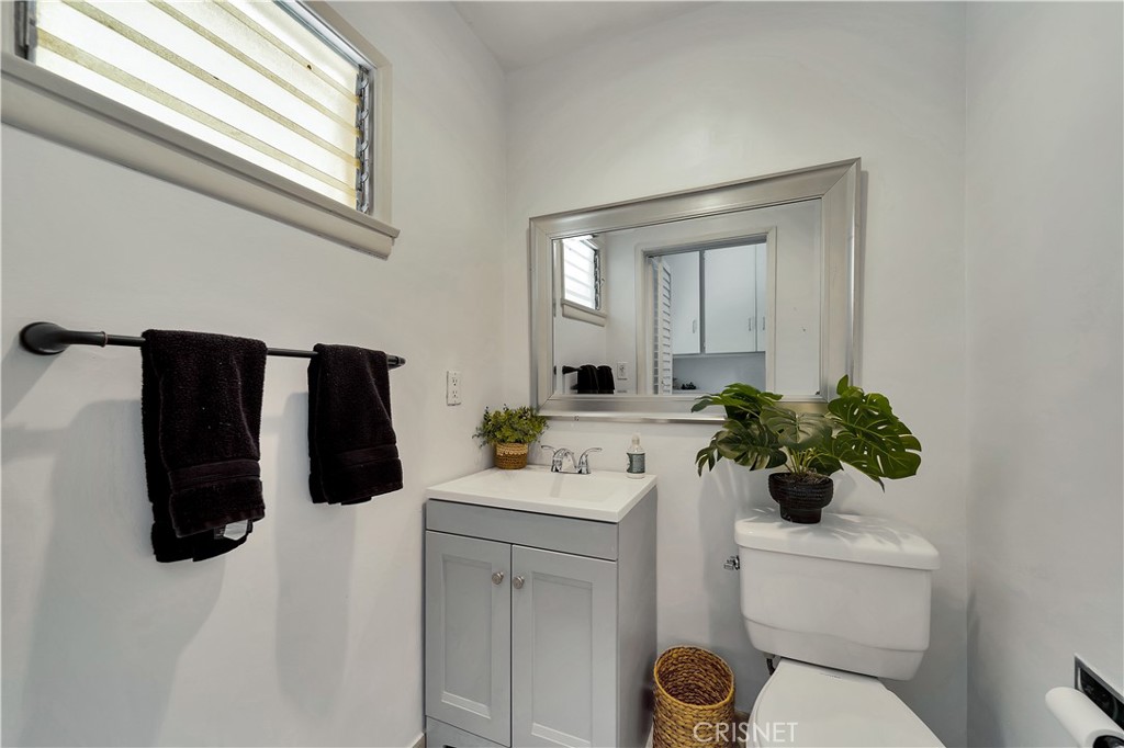 3667 Willowcrest Avenue Studio City, CA 91604 - Photo 14 of 49 a bathroom with a sink toilet and mirror