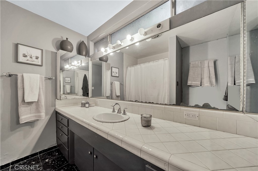 3667 Willowcrest Avenue Studio City, CA 91604 - Photo 23 of 49 a bathroom with a sink double vanity and a mirror