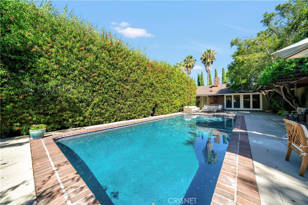 3667 Willowcrest Avenue Studio City, CA 91604 - Photo 29 of 49 a view of a swimming pool with a patio