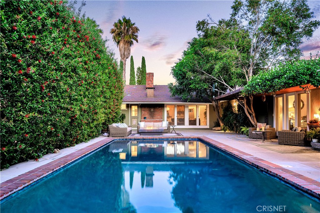 3667 Willowcrest Avenue Studio City, CA 91604 - Photo 36 of 49 a front view of a house with yard table and chairs