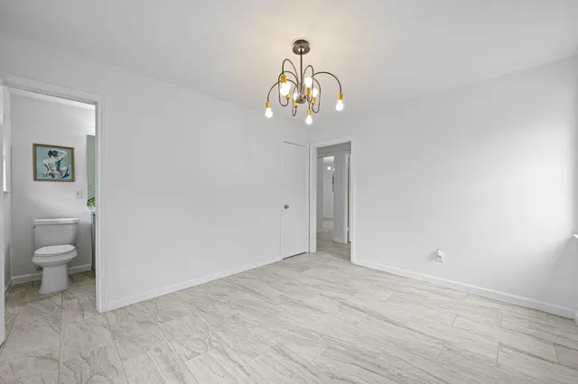 a view of an empty room with a bathroom