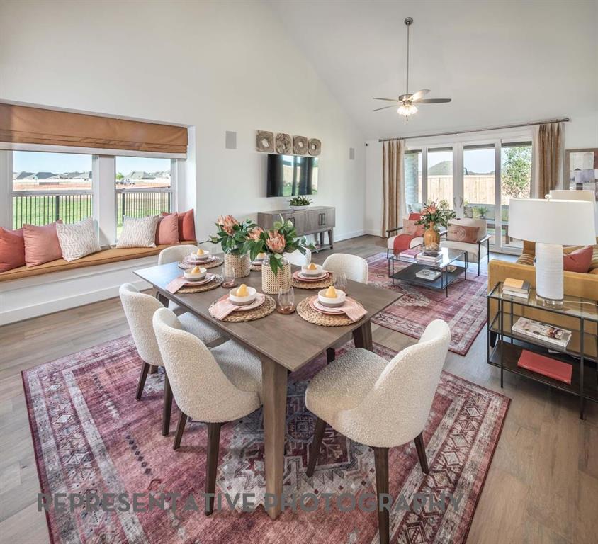 832 Stone Grv Road Lavon, TX 75166 - Photo 12 of 21 a view of a dining room with furniture window and wooden floor