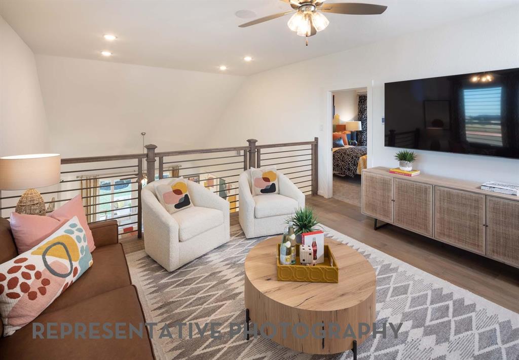 832 Stone Grv Road Lavon, TX 75166 - Photo 14 of 21 a living room with furniture and a flat screen tv