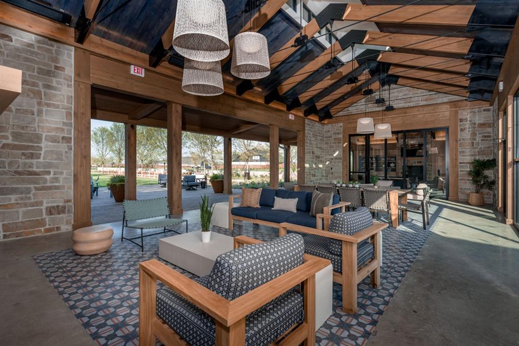 832 Stone Grv Road Lavon, TX 75166 - Photo 17 of 21 a outdoor space with lots of tables a large window and chairs