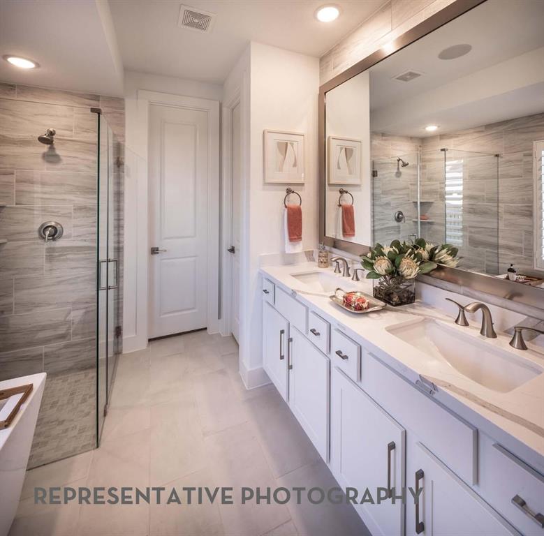 832 Stone Grv Road Lavon, TX 75166 - Photo 8 of 21 a spacious bathroom with a double vanity sink mirror and shower
