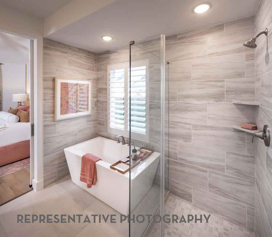 832 Stone Grv Road Lavon, TX 75166 - Photo 9 of 21 a spacious bathroom with a bathtub and shower