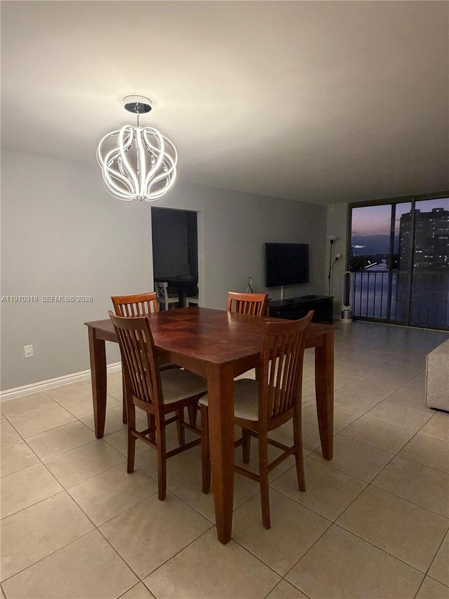17600 North Bay Road, Unit N907 Sunny Isles Beach, FL 33160 - Photo 12 of 22 a view of a dining room with furniture