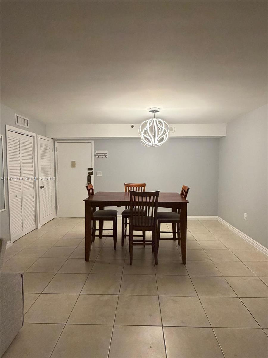 17600 North Bay Road, Unit N907 Sunny Isles Beach, FL 33160 - Photo 14 of 22 a dining room well furnished