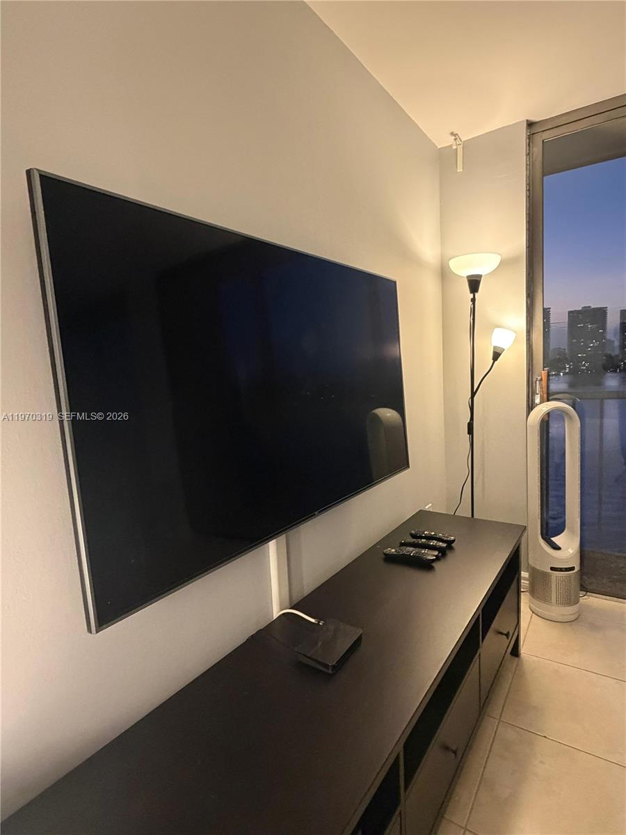 17600 North Bay Road, Unit N907 Sunny Isles Beach, FL 33160 - Photo 17 of 22 a kitchen with a refrigerator and a stove