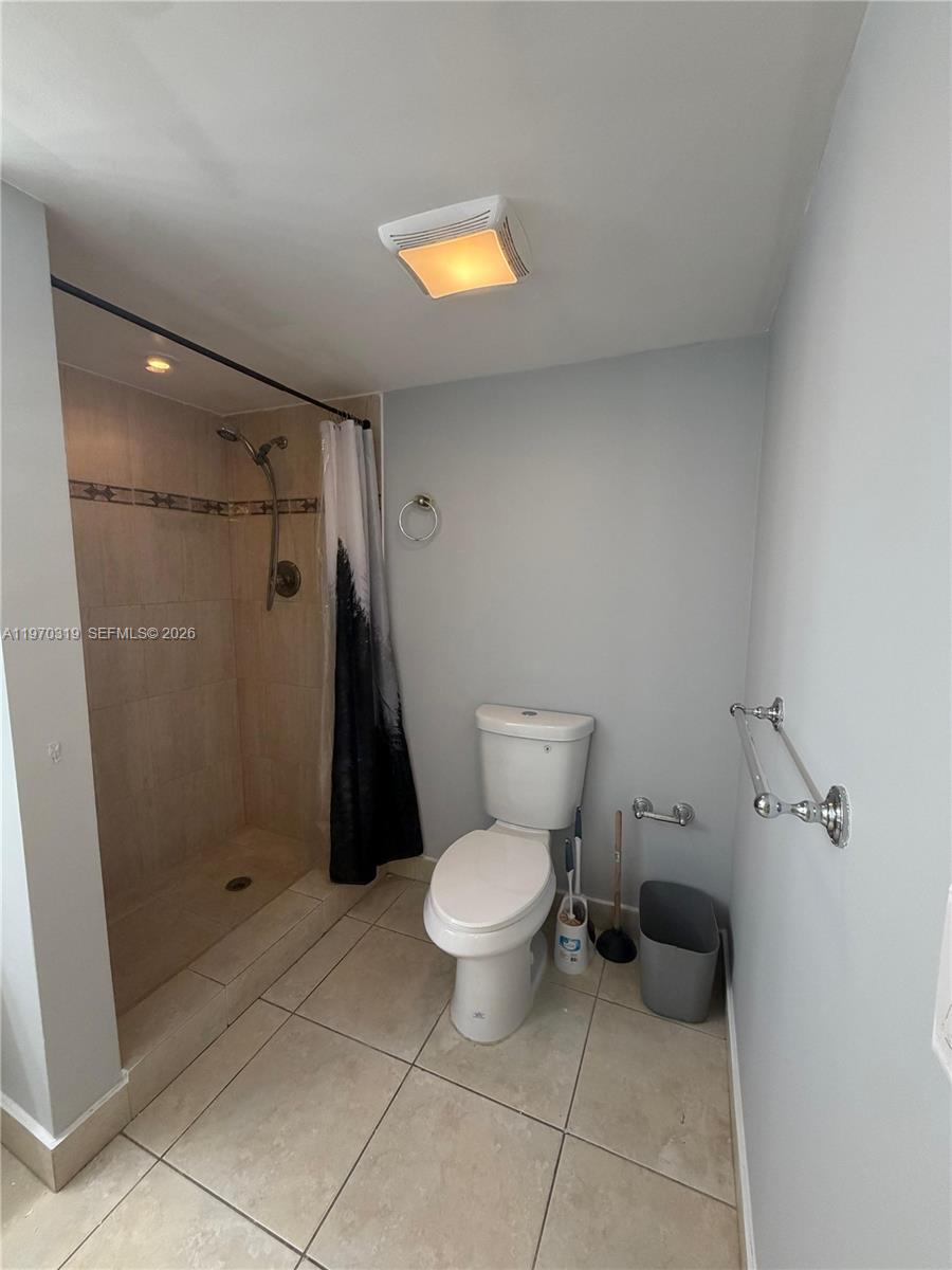 17600 North Bay Road, Unit N907 Sunny Isles Beach, FL 33160 - Photo 22 of 22 a bathroom with a toilet and a shower