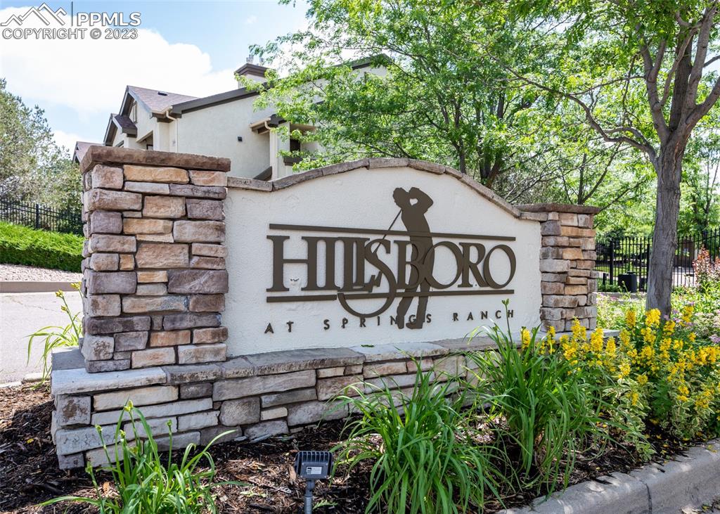 3847 Riviera Grove, Unit 203 Colorado Springs, CO 80922 - Photo 2 of 32 a front view of a house with garden