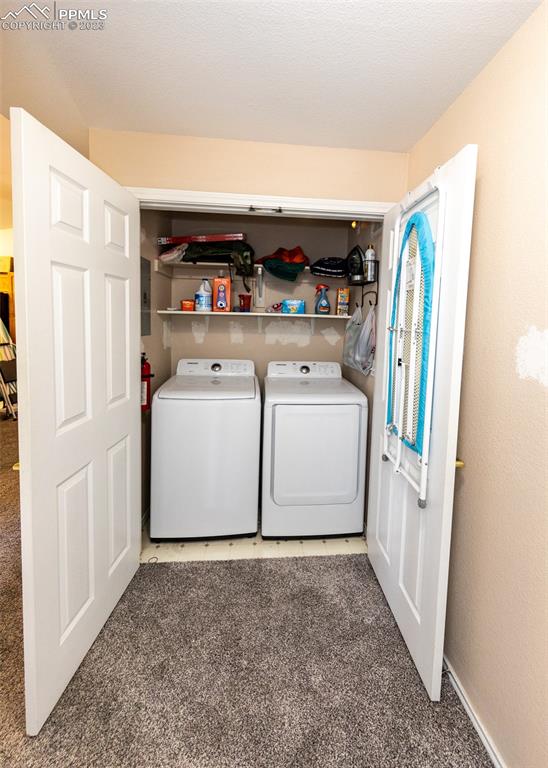 3847 Riviera Grove, Unit 203 Colorado Springs, CO 80922 - Photo 26 of 32 a utility room with dryer and washer