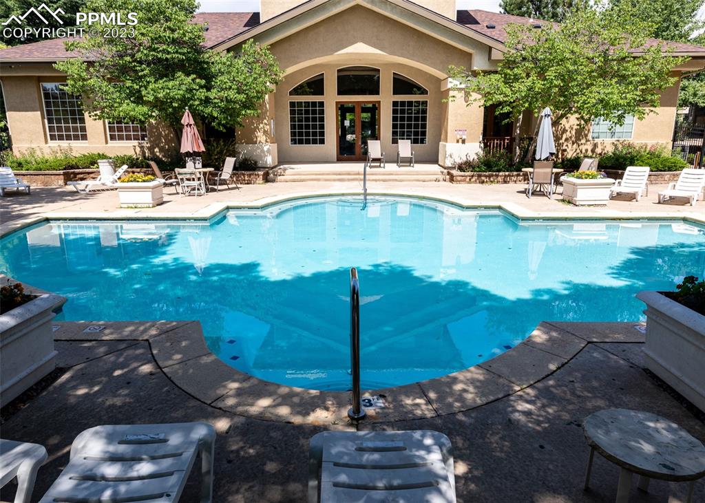 3847 Riviera Grove, Unit 203 Colorado Springs, CO 80922 - Photo 29 of 32 a view of a house with backyard and sitting area