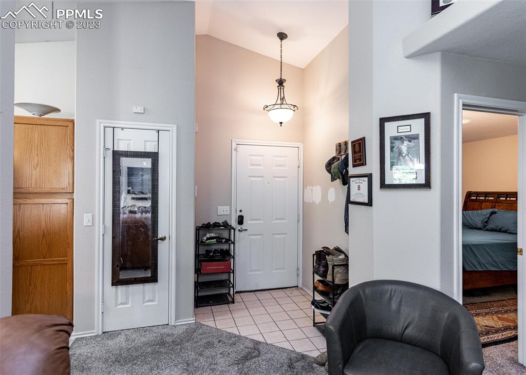 3847 Riviera Grove, Unit 203 Colorado Springs, CO 80922 - Photo 5 of 32 a bedroom with a bed and a couch