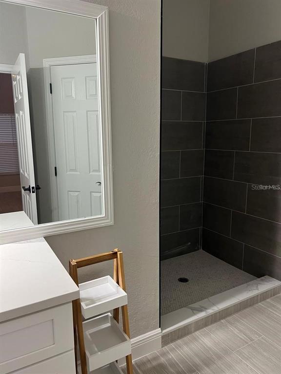 2917 Conner Lane Kissimmee, FL 34741 - Photo 6 of 10 a bathroom with a shower