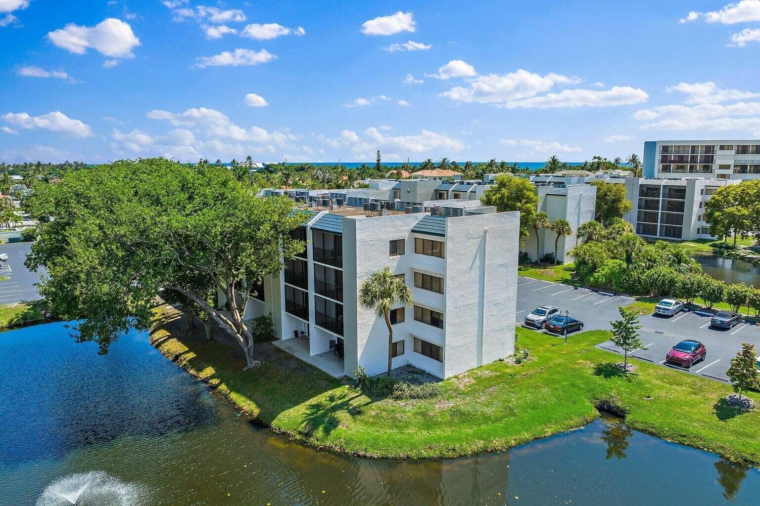 1605 Highway 1, Unit C302 Jupiter, FL 33477 - Photo 22 of 30 a view of a houses with yard