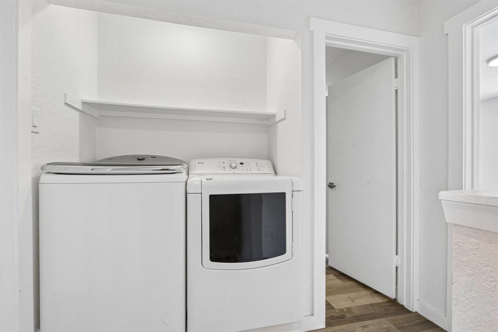 2400 Jupiter Road, Unit 6 Plano, TX 75074 - Photo 18 of 22 Dedicated laundry area featuring a built-in shelf, white walls, and wood-finish flooring