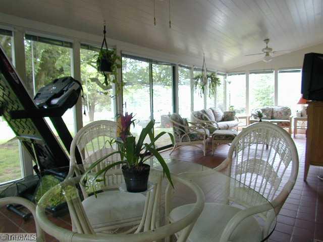 3136 Baltimore Road East Bend, NC 27018 - Photo 3 of 16 Sunroom. Tiled 350sf sunroom off of the great room and kitchen for relaxed dining and entertainment