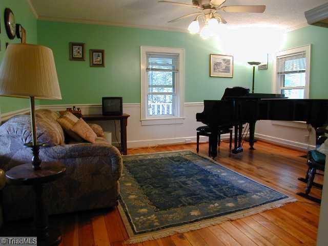 3136 Baltimore Road East Bend, NC 27018 - Photo 7 of 16 1st Bedroom. Pine Floors in left front bedroom presently being used as a music room.