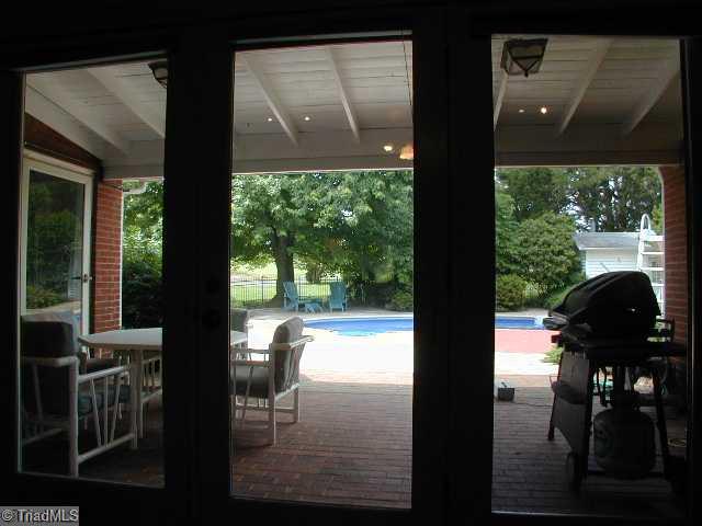 3136 Baltimore Road East Bend, NC 27018 - Photo 10 of 16 Swimming Pool/Hot Tub/Sauna. View from the Great Room to sheltered Patio, Pool and Pool House