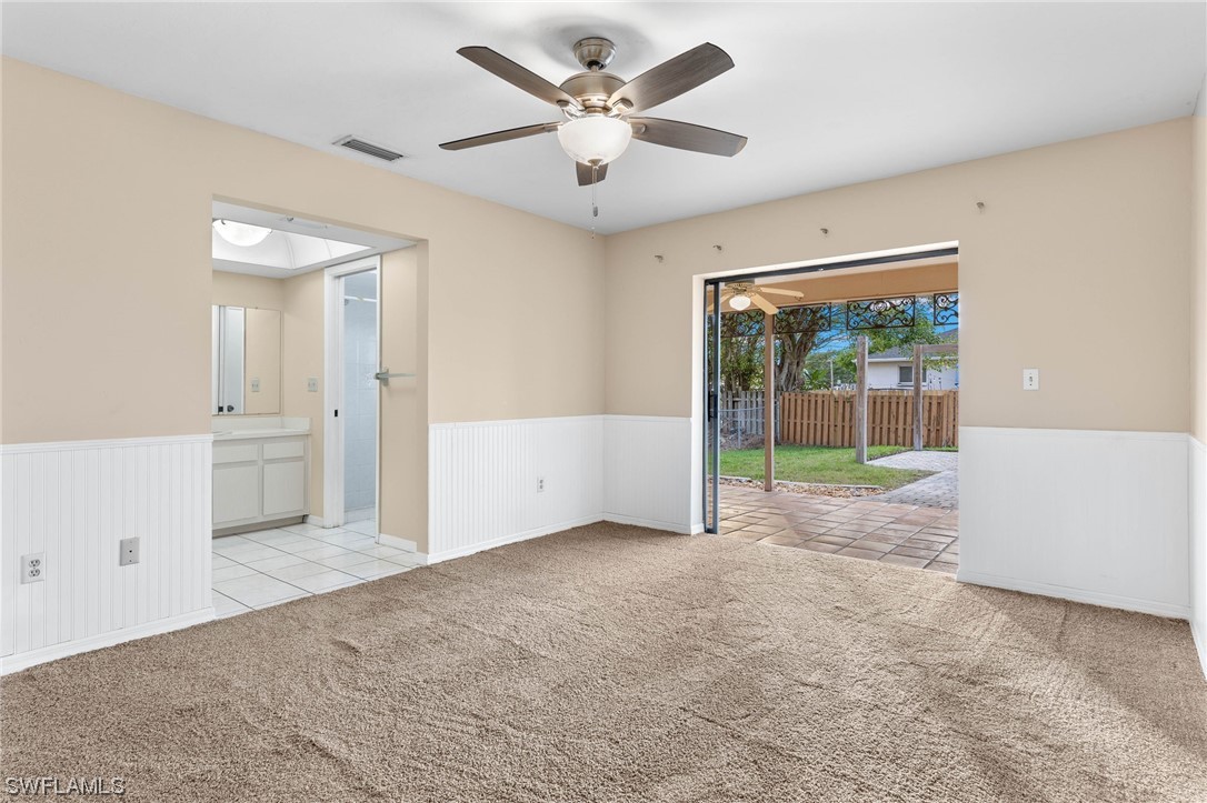 17568 Fuchsia Road Fort Myers, FL 33967 - Photo 13 of 31 an empty room with fan and a ceiling fan