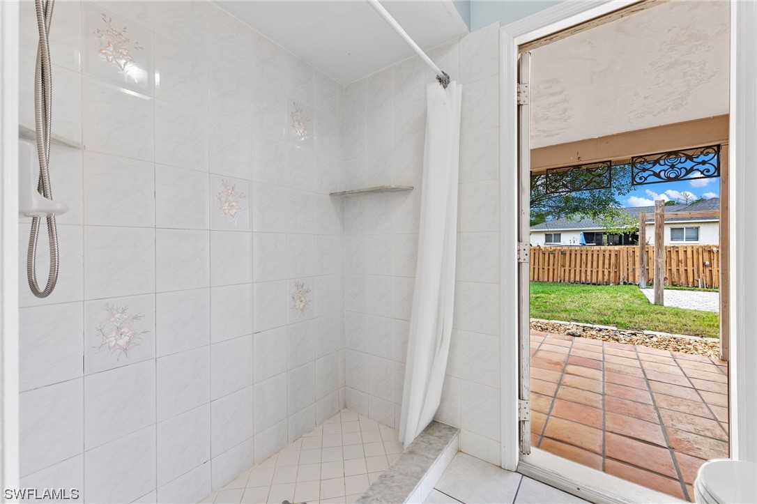 17568 Fuchsia Road Fort Myers, FL 33967 - Photo 17 of 31 a bathroom with a shower