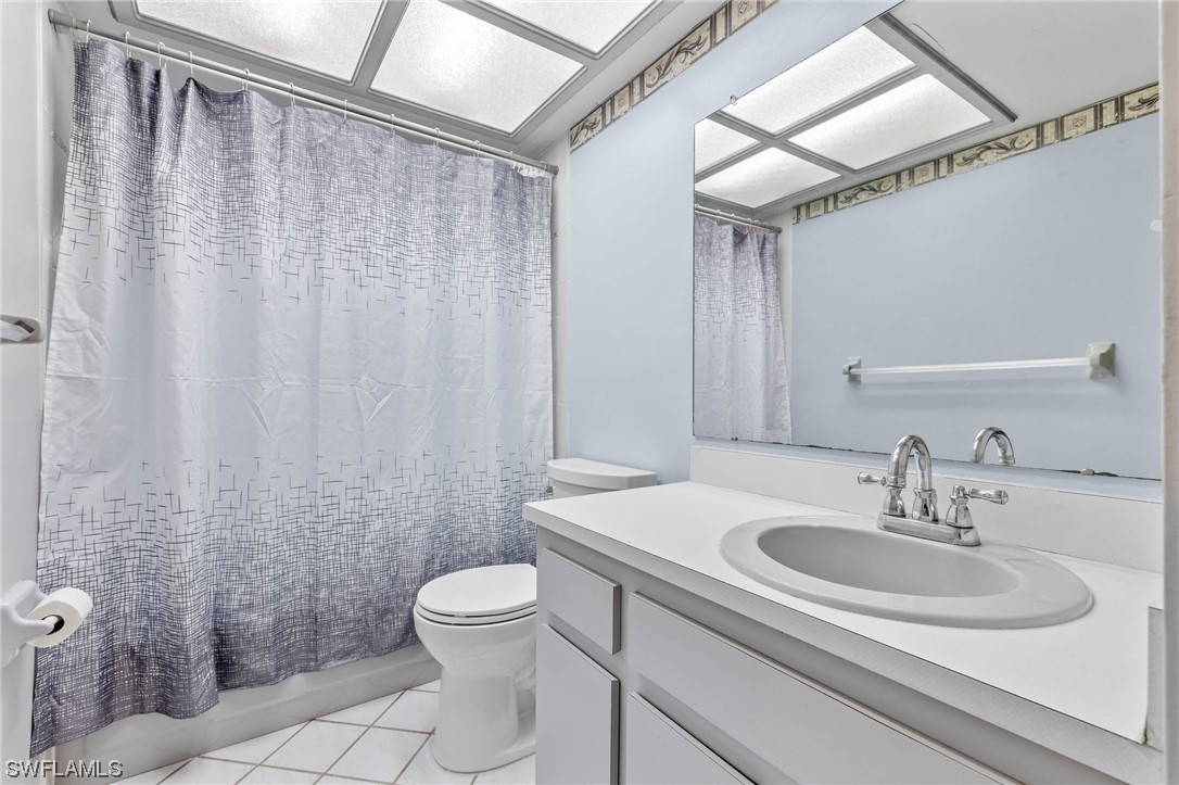 17568 Fuchsia Road Fort Myers, FL 33967 - Photo 19 of 31 a bathroom with a sink toilet and shower