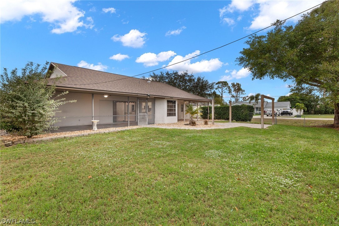 17568 Fuchsia Road Fort Myers, FL 33967 - Photo 25 of 31 a view of a house with a backyard