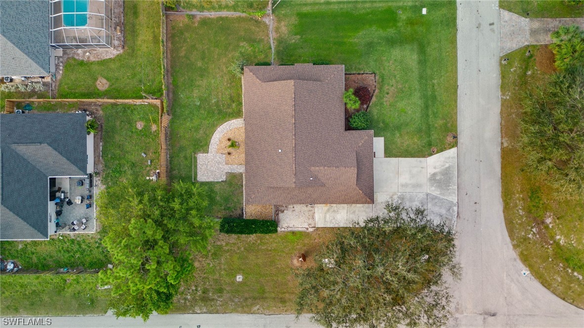 17568 Fuchsia Road Fort Myers, FL 33967 - Photo 27 of 31 an aerial view of a house with garden space and a yard