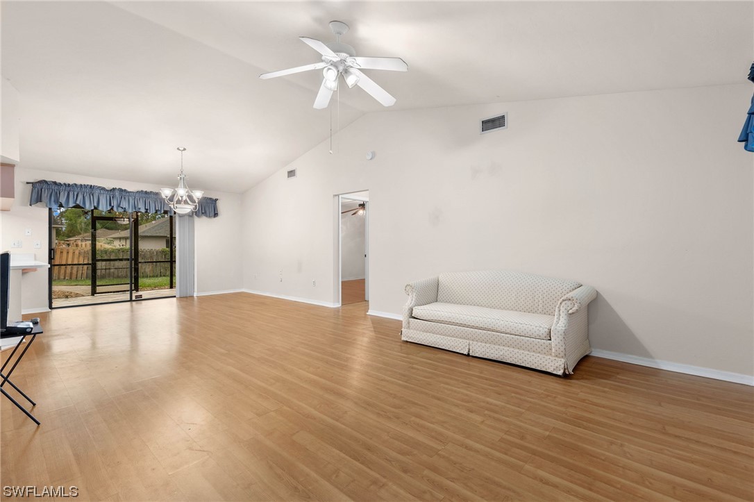 17568 Fuchsia Road Fort Myers, FL 33967 - Photo 4 of 31 an empty room with wooden floor and ceiling fan
