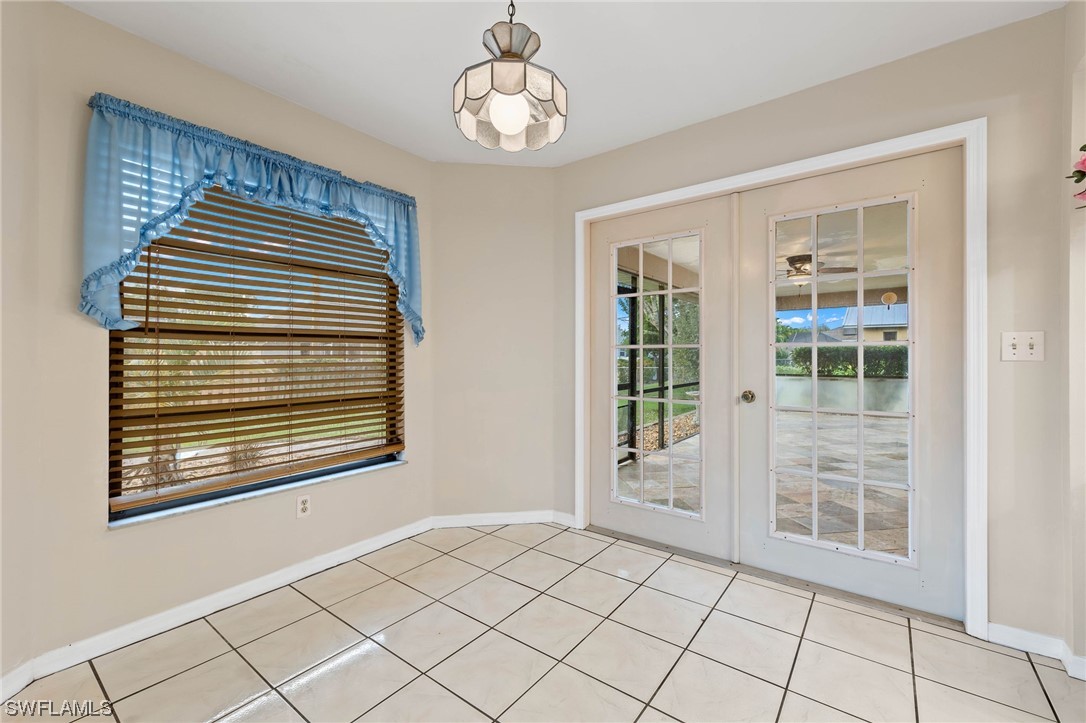 17568 Fuchsia Road Fort Myers, FL 33967 - Photo 9 of 31 a view of an empty room with windows