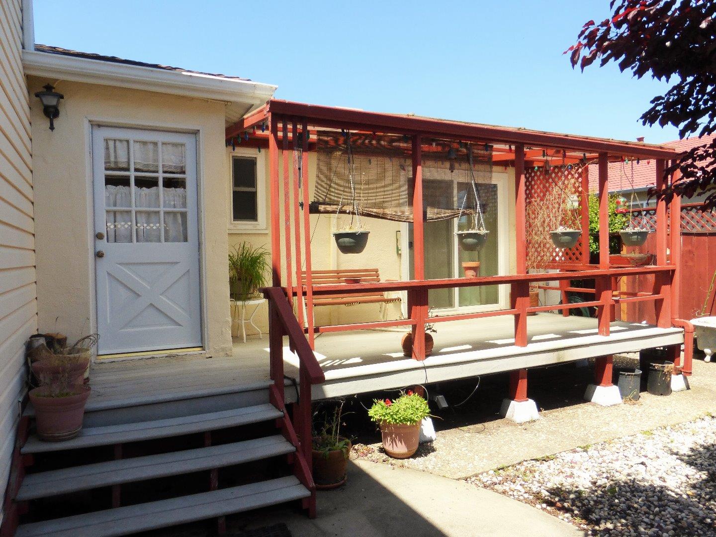 455 Helen Drive Millbrae, CA 94030 - Photo 27 of 29 a view of a balcony with two chairs and a potted plant