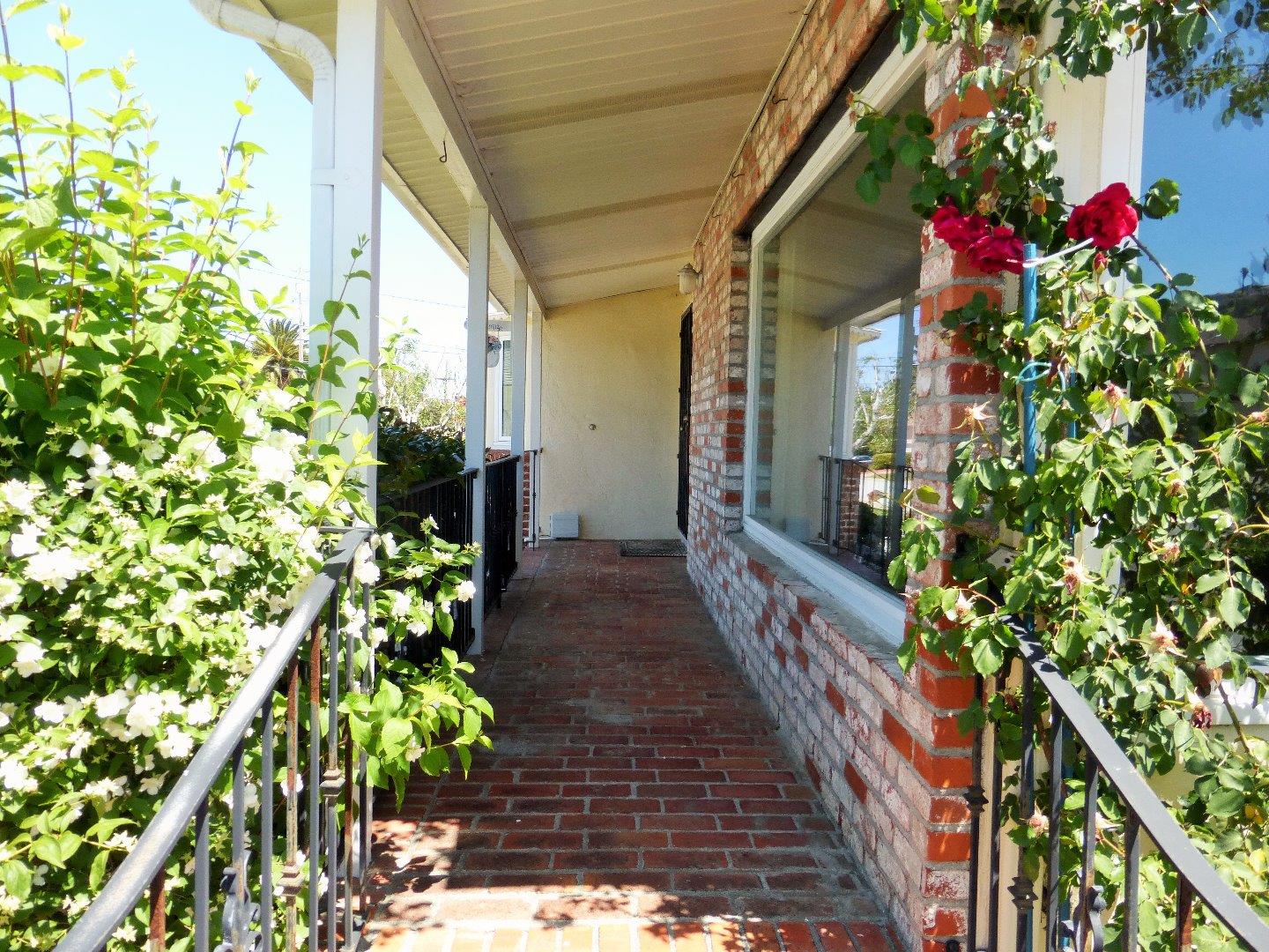 455 Helen Drive Millbrae, CA 94030 - Photo 4 of 29 a view of a house with a flower garden
