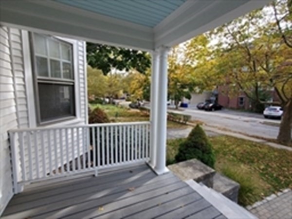 29 Bartlett Crescent Brookline, MA 02446 - Photo 15 of 27 a view of a porch with wooden floor and fence