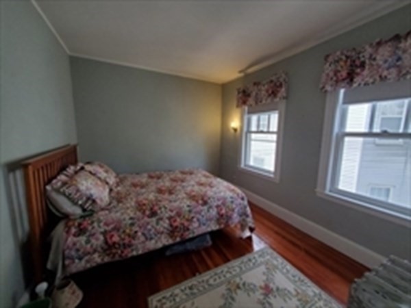 29 Bartlett Crescent Brookline, MA 02446 - Photo 16 of 27 a bedroom with bed and window