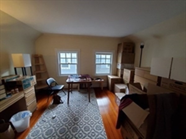 29 Bartlett Crescent Brookline, MA 02446 - Photo 20 of 27 a living room with furniture and a window