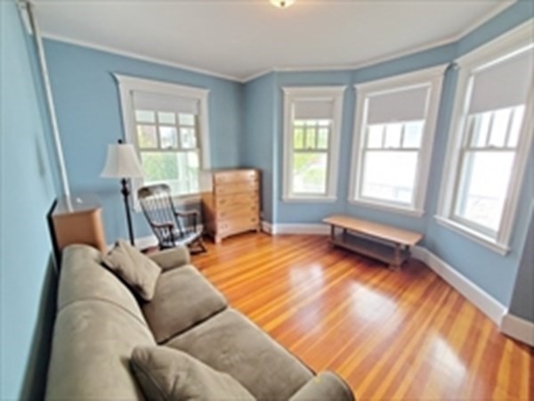 29 Bartlett Crescent Brookline, MA 02446 - Photo 2 of 27 a living room with furniture and a window