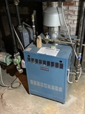 29 Bartlett Crescent Brookline, MA 02446 - Photo 25 of 27 a kitchen with a stove and a wooden floor